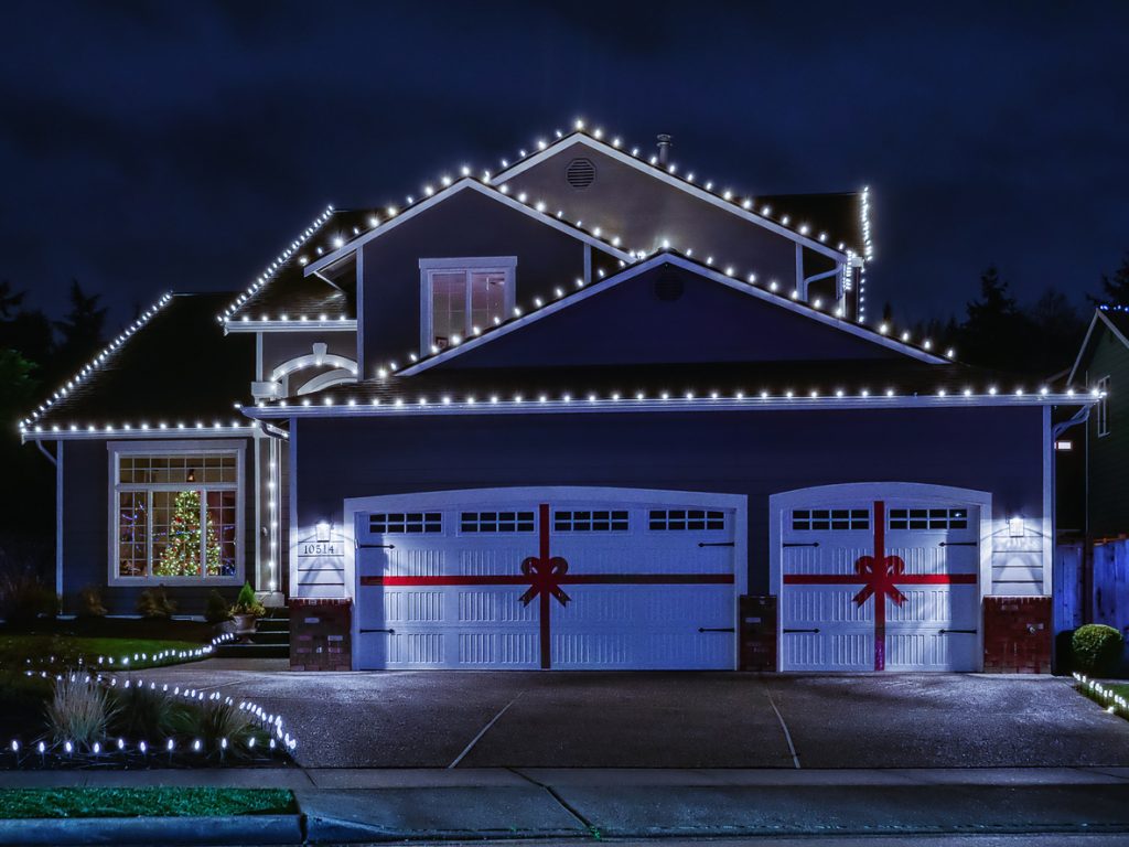 American suburban home exterior with festive Christmas lights